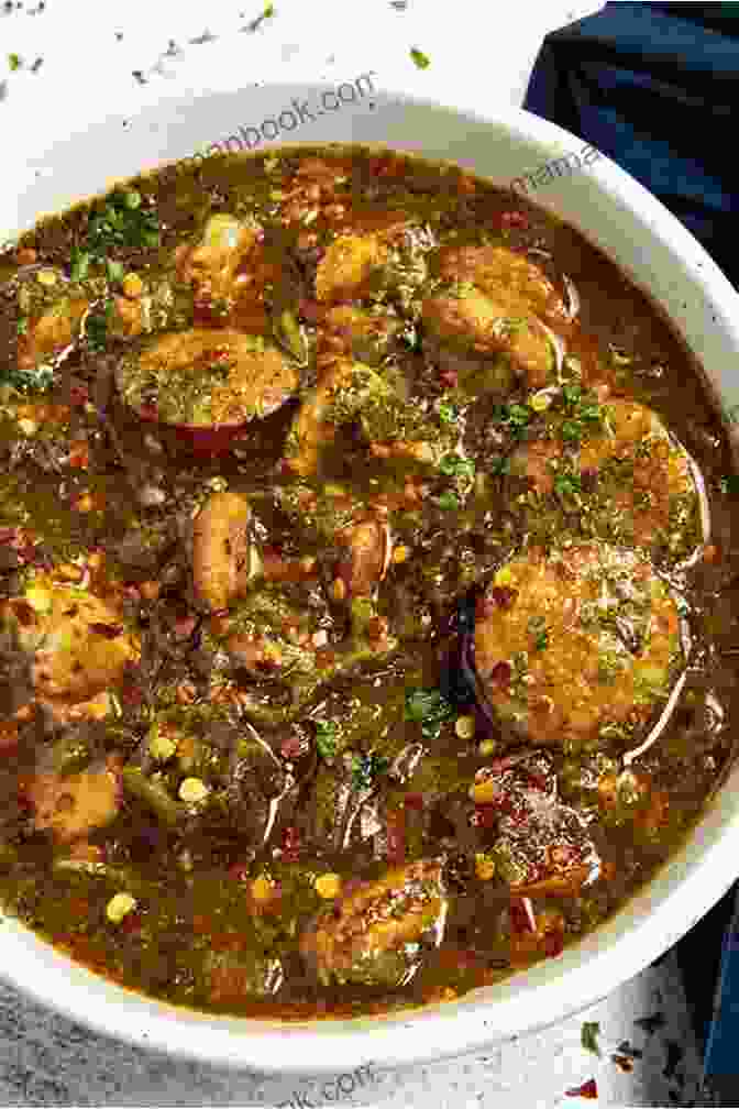 A Bowl Of Chicken And Sausage Gumbo, A Cajun Stew Made With Chicken, Sausage, Vegetables, And A Rich Roux Based Sauce. Mouthwatering Cajun Recipes That Are Not Only Etouffee And Jambalaya : The Best Cajun Cookbook For Beginners And Pro Chefs