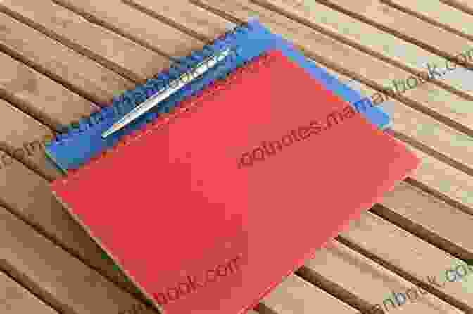 A Close Up Image Of A Red Notebook With A Pen Resting On Top. The Red Notebook (The Notebook Series)