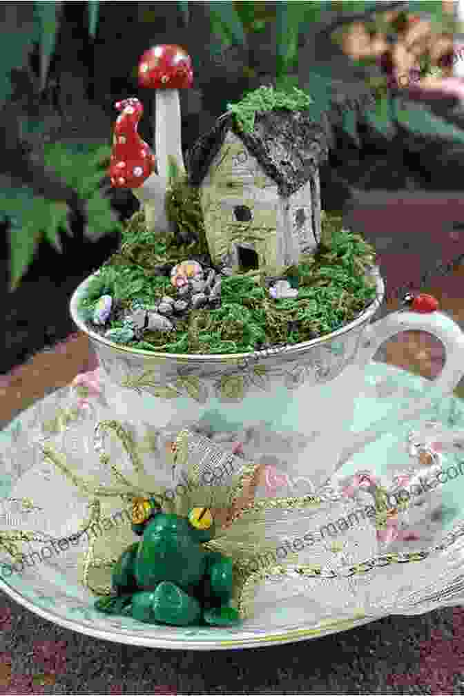 A Teacup Transformed Into A Miniature Garden With Tiny Flowers, Butterflies, And A Whimsical Toadstool. Tea Cup Of Love Valerie Strawmier